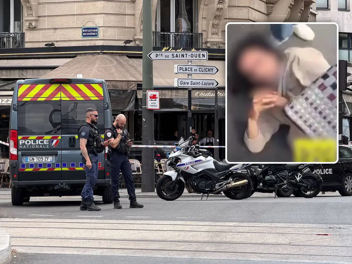 Agenten van de Police Nationale bij een afgezette straat aan de Boulevard Bessieres in Parijs, met politiebusje en motoren